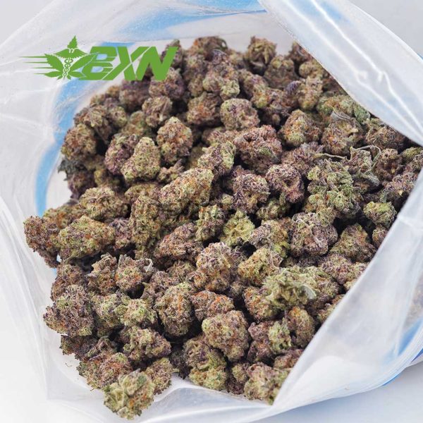 A bag filled with quality purple and dark green marijuana buds.