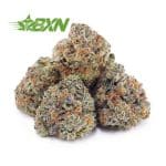 A bunch of green and orange cannabis buds