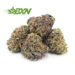 A pile of green, purple, and brown marijuana buds